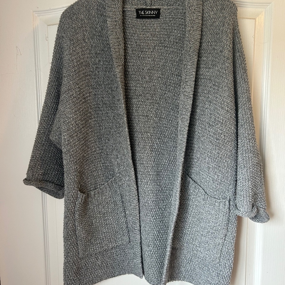 The Skinny. Woman’s classic knit cardigan. Medium Thigh length. Cozy , casual .
